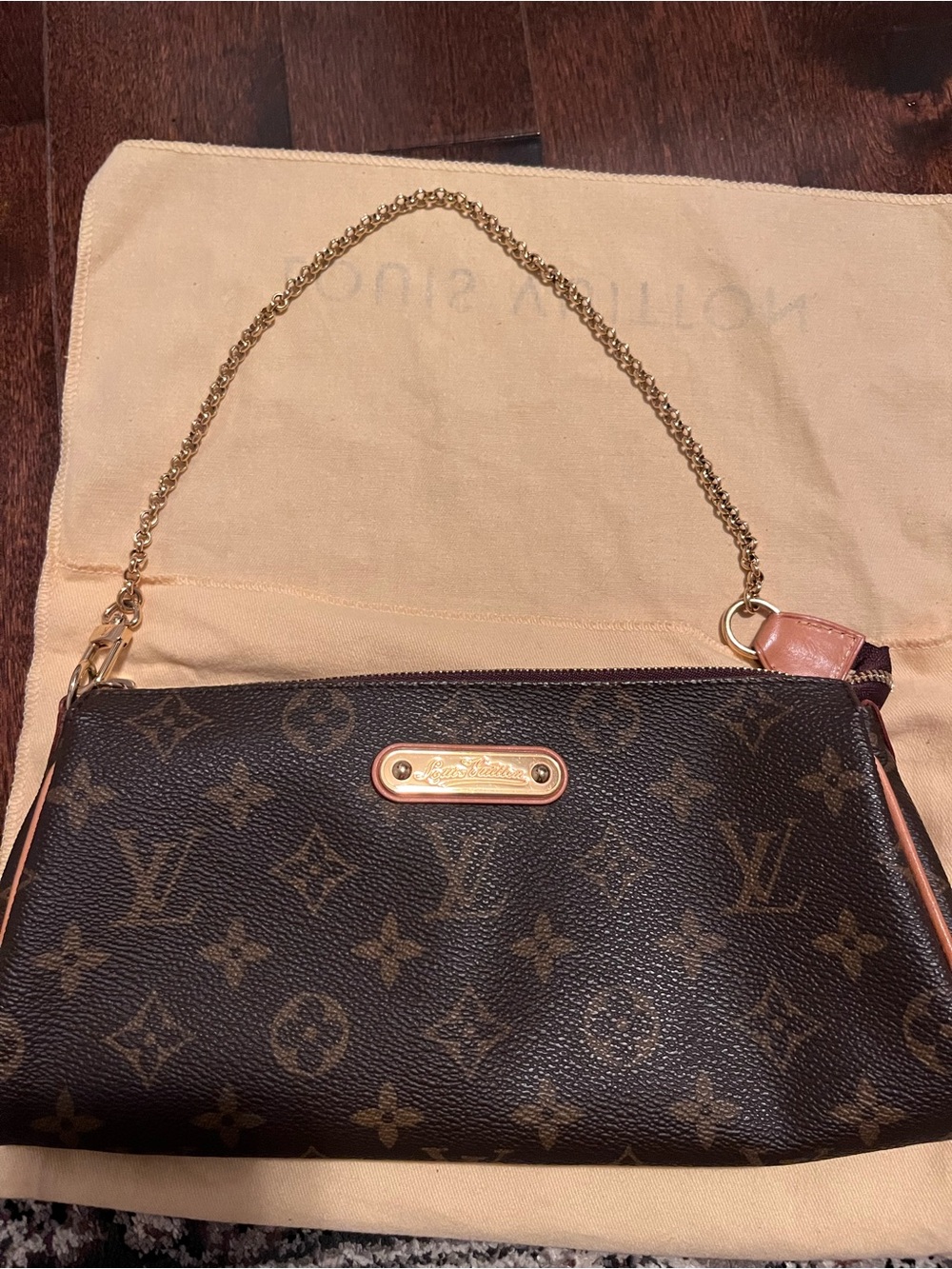 Authentic Louis Vuitton Eva monogram clutch